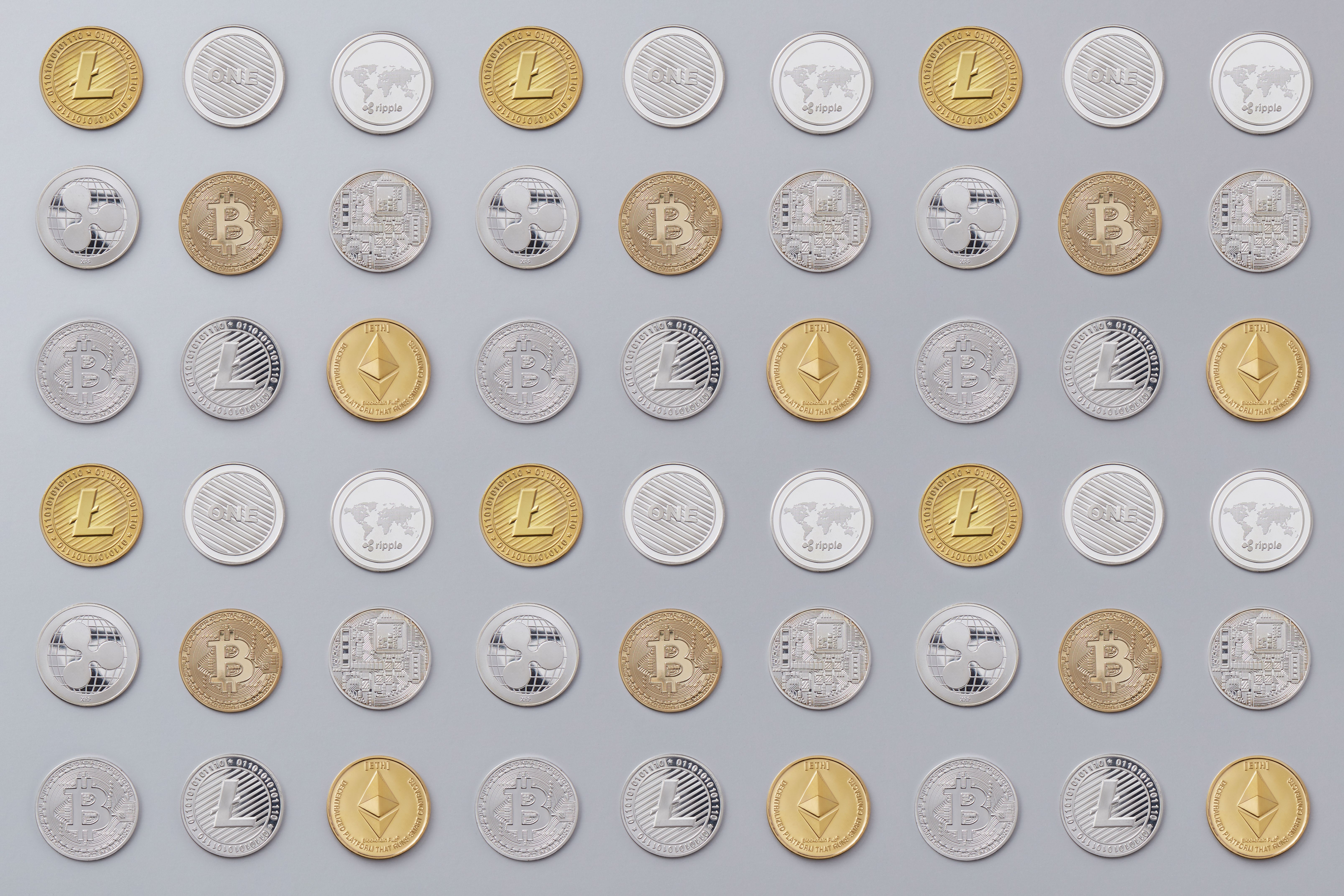 Grid of physical crypto coins - Bitcoin, Litecoin, Ripple, Ethereum